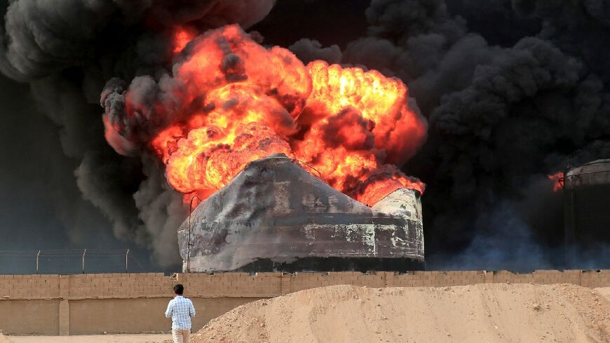 Yemen firefighters struggle against port blaze after Israel strikes